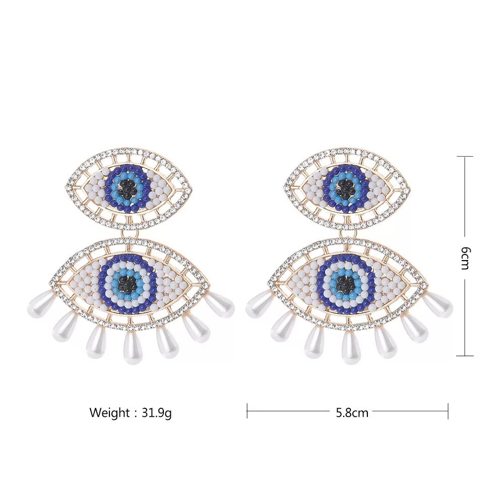 Dangle eye earrings